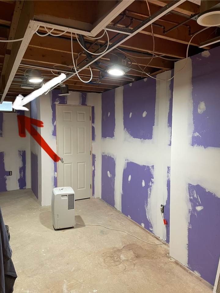Basement walls with drywall hung and ready for finishing