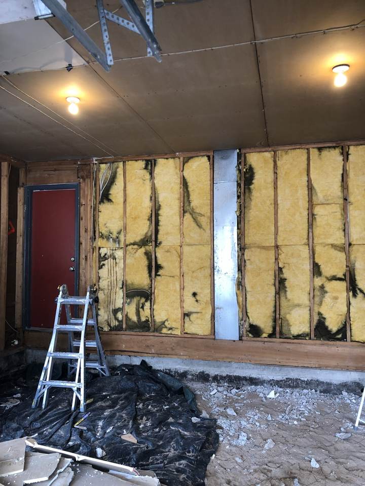 Basement wall framing with insulation before drywall