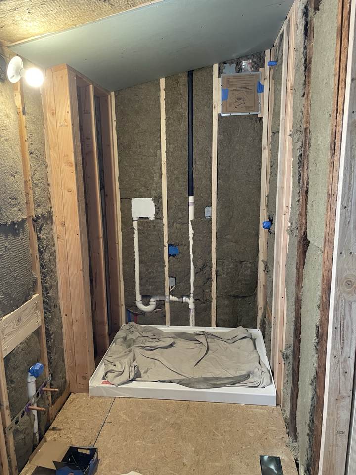 Bathroom framing with new plumbing and shower pan