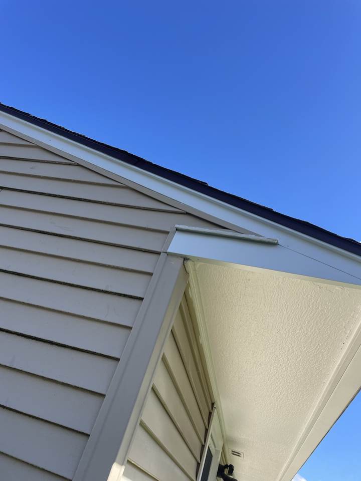 New white aluminum fascia wrapped at a roof corner
