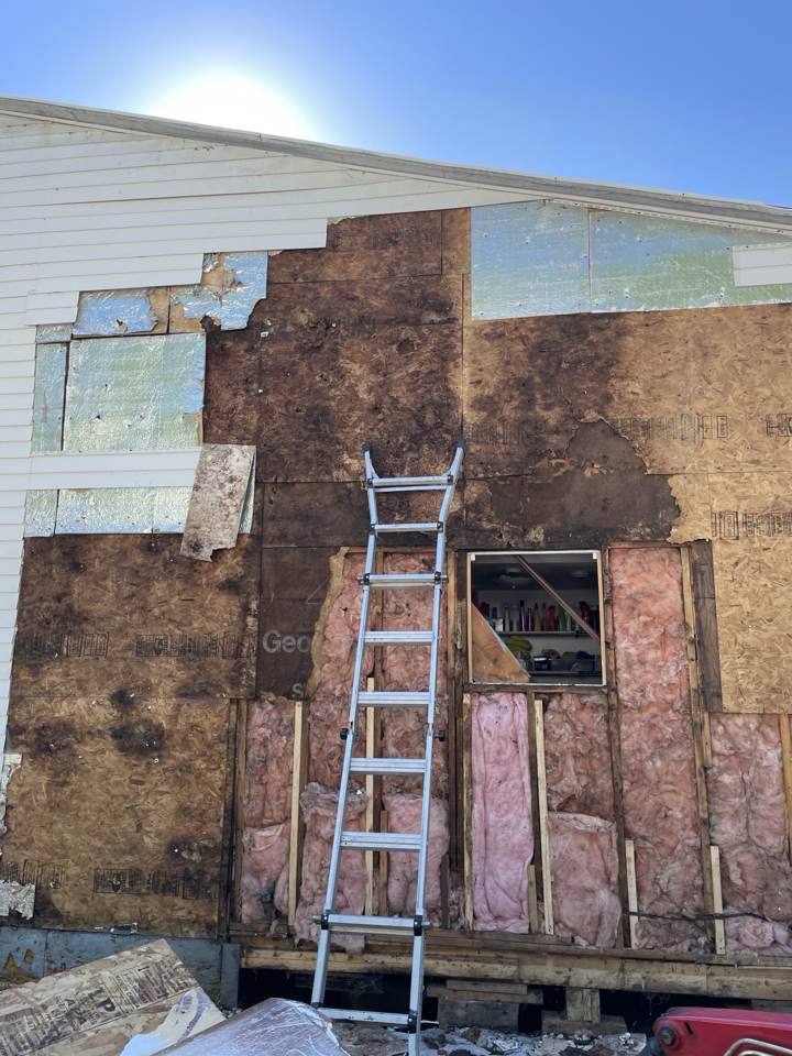 Exterior wall opened up to repair rotted sheathing and framing