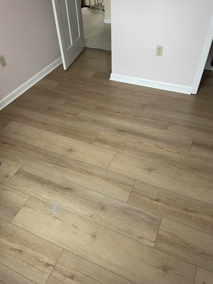 New vinyl plank flooring installed in a bedroom