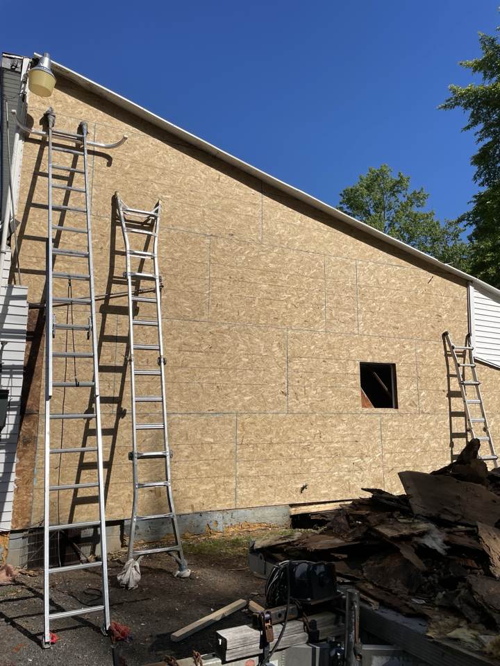 New OSB sheathing on an exterior wall after rot repair